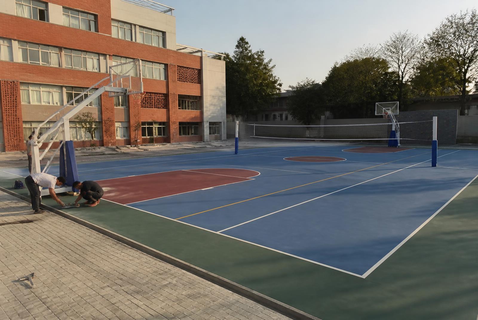 Completed institutional multi-sport court being inspected after installation
